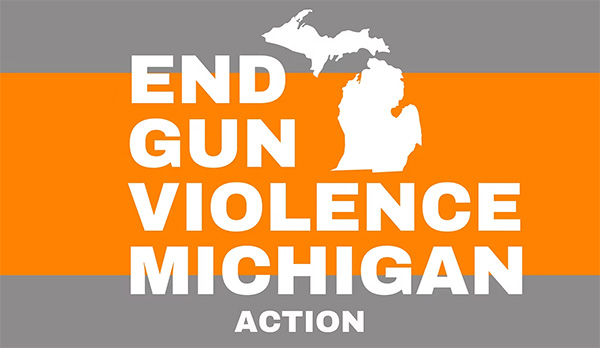 A campaign graphic with bold white text reading 'END GUN VIOLENCE MICHIGAN ACTION' over an orange stripe on a gray background, with a white Michigan silhouette above the text.