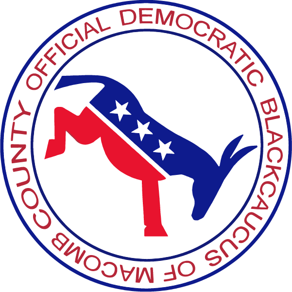 Circular logo for the Macomb County Official Democratic Black Caucus, with red and blue text around a stylized donkey in the center.